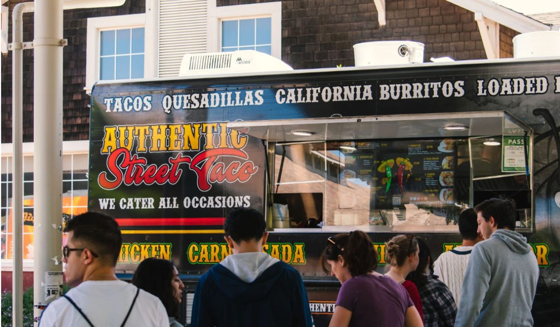 Employees lined up at the Authentic Street Taco truck window outside a Sacramento office